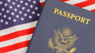 US Passport in front of a US Flag background
